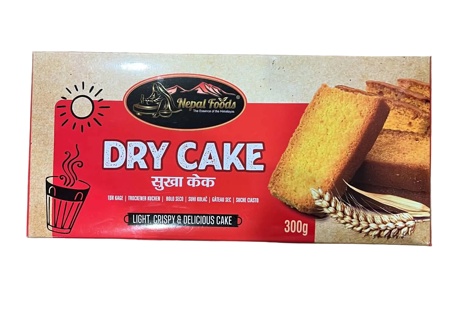 A 300g box of Nepal Roadi Dry Cake placed on a brown cardboard shipping box. The packaging features a red and beige design with an illustration of a steaming cup and an image of a slice of golden-brown cake.