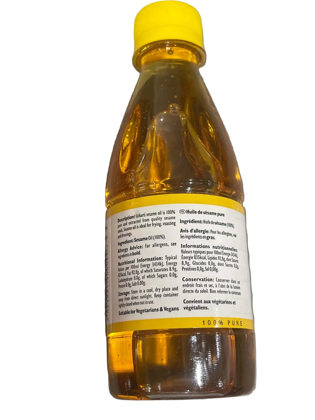 A bottle of organic sesame oil with a white cap and a white label showing product details in French, photographed on a neutral gray background.