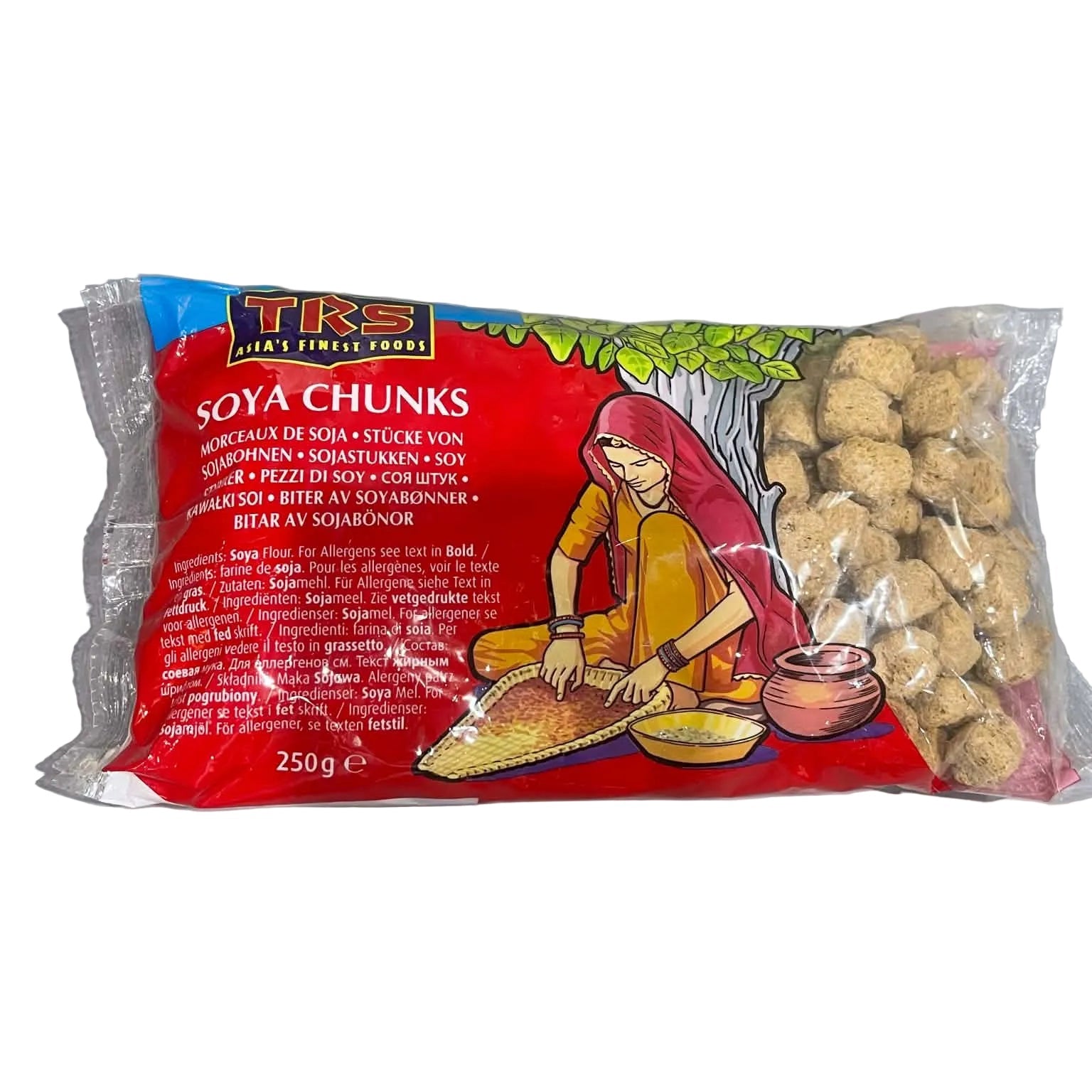 A 250g package of TKS Soya Chunks, featuring a bright red label with a traditional Indian illustration of a woman grinding pulses, alongside a clear window showing the beige soy chunks inside, set on a gray surface.