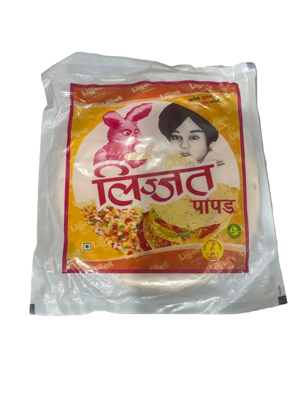A vacuum-sealed package of Indian flatbread (pappad) with a colorful label featuring Hindi text, a pink rabbit illustration, and food imagery, placed on a gray surface.