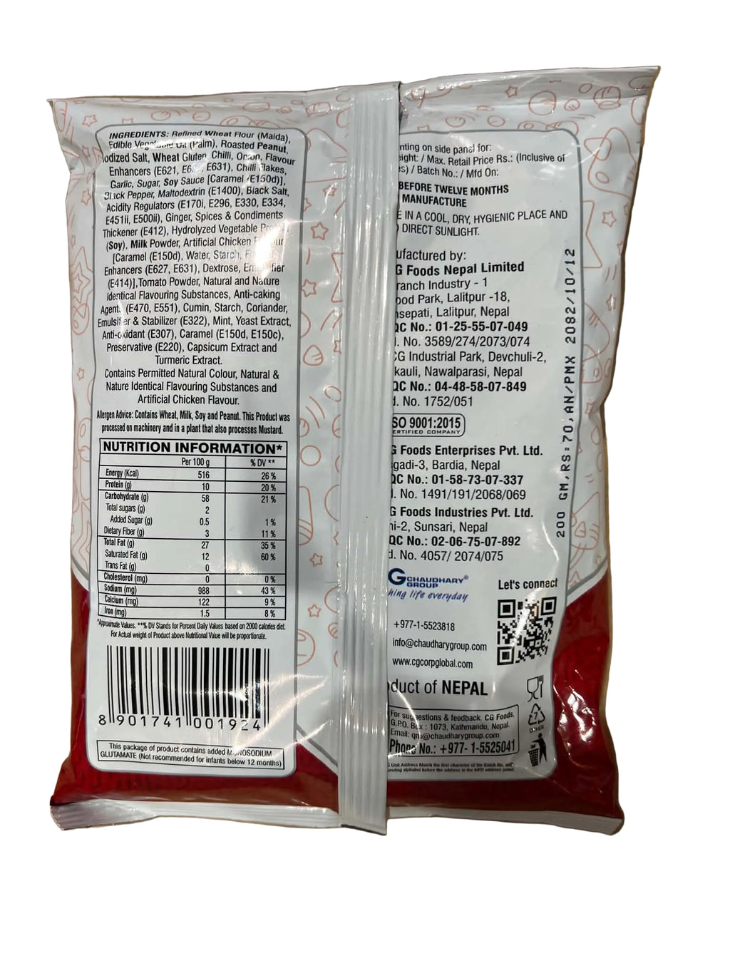 The back of a packaged food pouch showing detailed ingredient and nutrition information, photographed on a brown cardboard background.