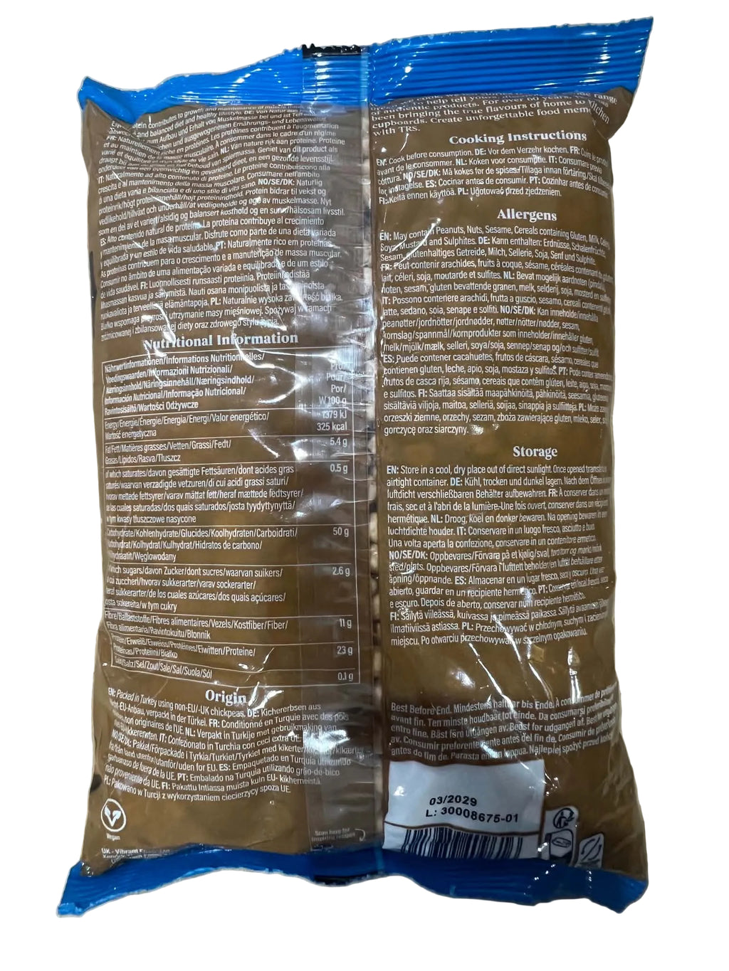 The back of a brown plastic bag of baked goods, sealed with a clear plastic band across the middle, photographed on a beige surface.
