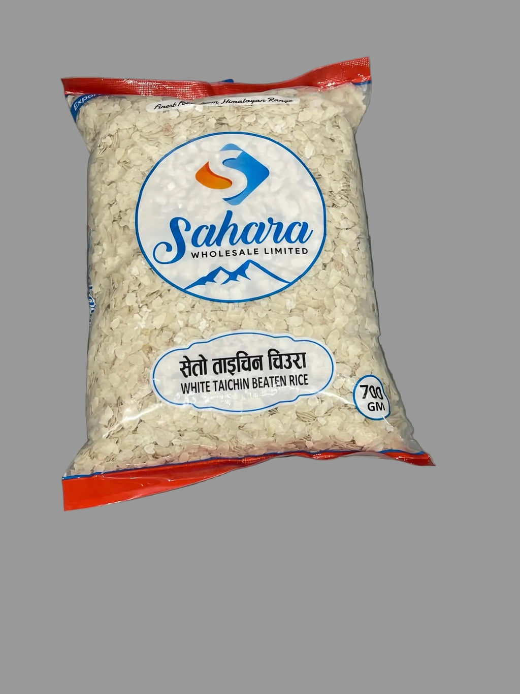 A 700g bag of Sahara Wholesale Limited White Taichin Beaten Rice, displayed on a gray surface.