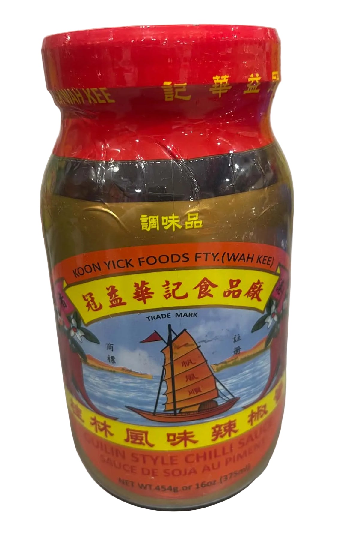 A bottle of Woon Yick Foods FTY (Wah Kee) Chili Sauce, featuring a red cap and a colorful label with Chinese characters and a sailboat illustration, set on a light-colored countertop.