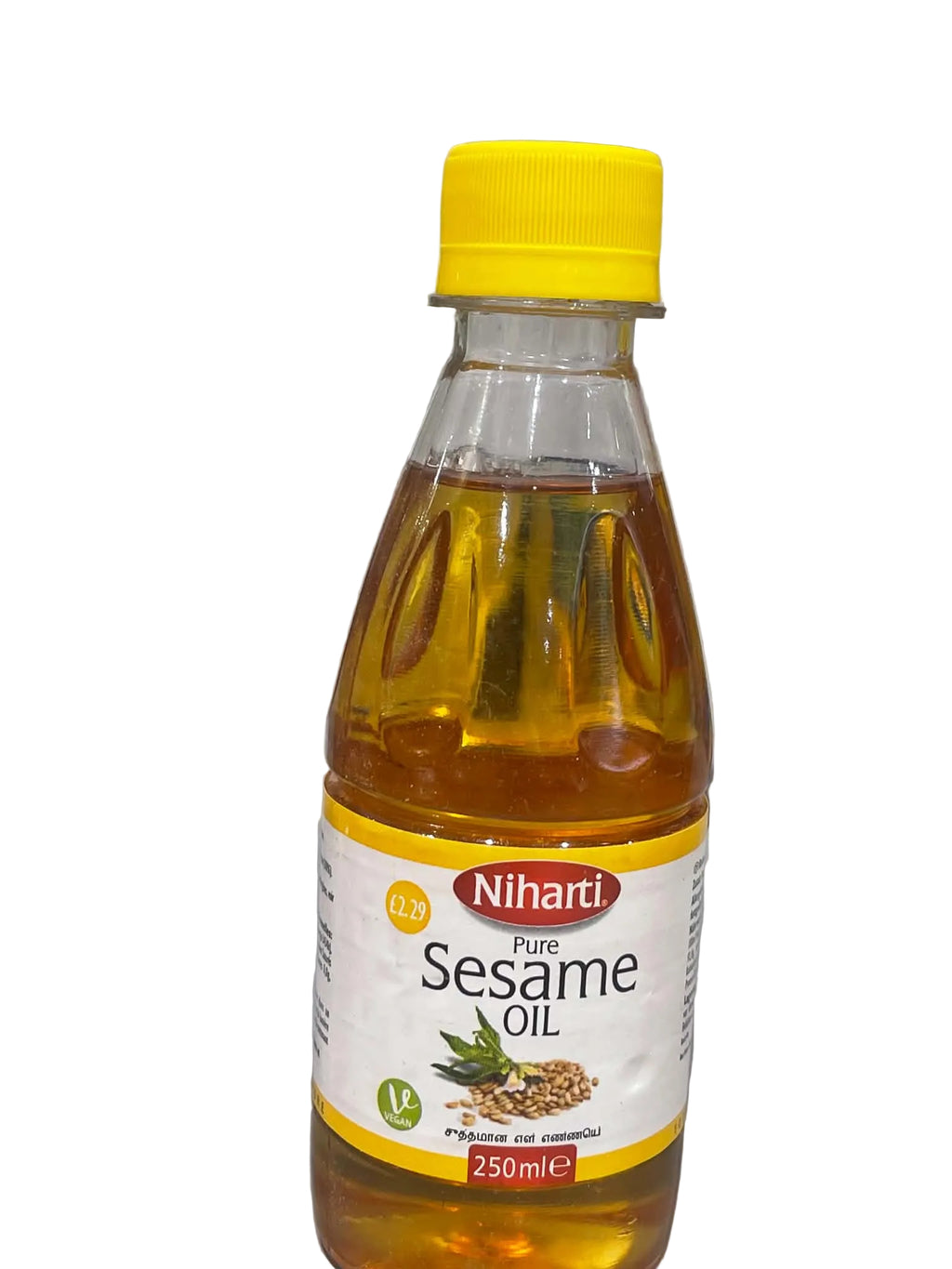 A 250ml bottle of Niharti Pure Sesame Oil with a bright yellow cap and white label, filled with golden-yellow oil, set against a gray marble-patterned background.