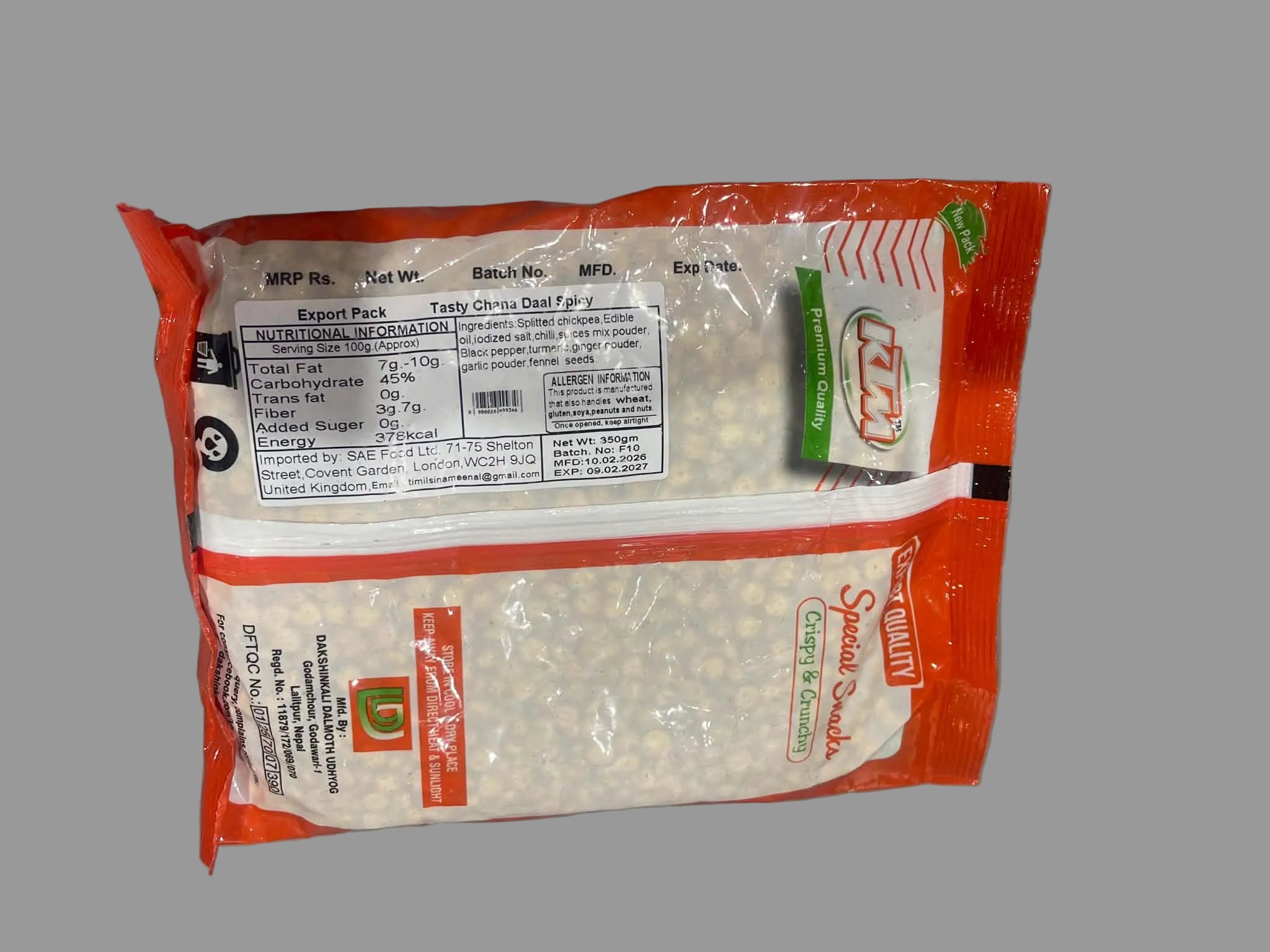 A package of Sweet Corn Flakes by MTF, featuring a clear plastic bag filled with white corn flakes and sealed in a bright orange-red plastic wrapper with a white label and green accents.