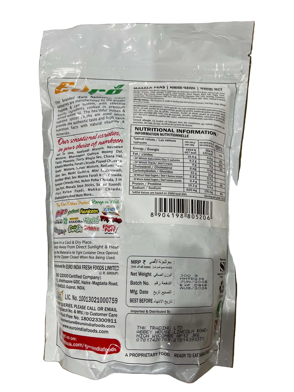 A white plastic bag of Emdar Gula Rasada sugar powder, showing the back side with nutritional information, barcode, and contact details, placed on a brown cardboard surface.