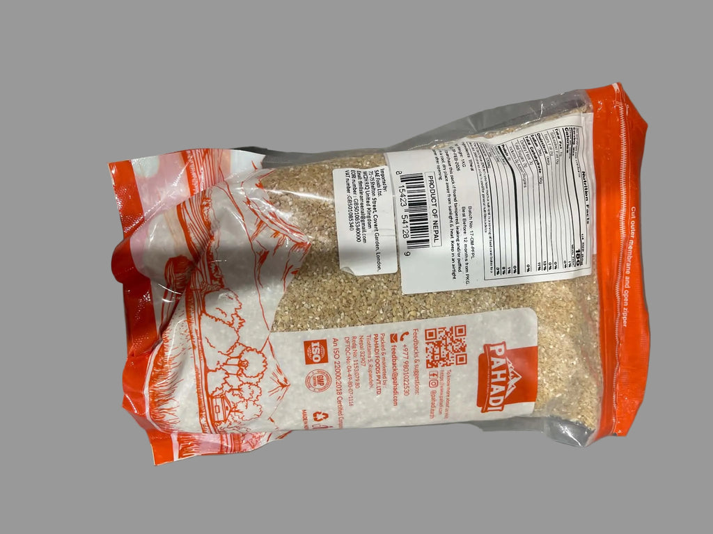 A package of Parodi rice, showing the back of the clear plastic bag with orange borders, white labels, and a barcode, placed on a gray surface.