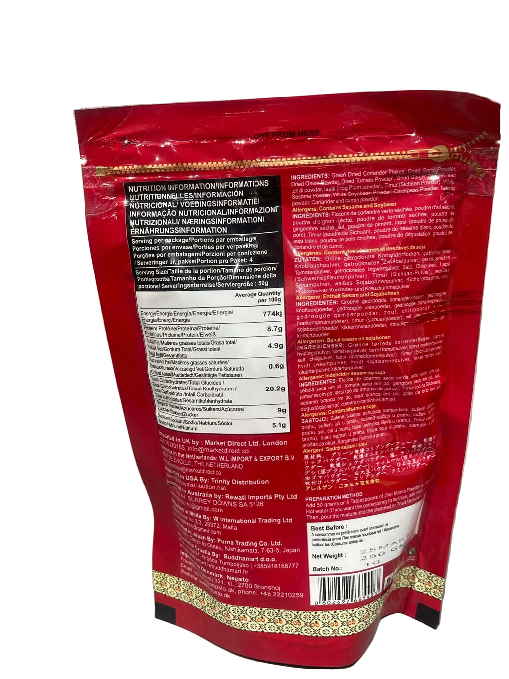 The back of a red stand-up pouch package, showing nutritional facts, ingredients, and product details in multiple languages, photographed on a light gray surface.