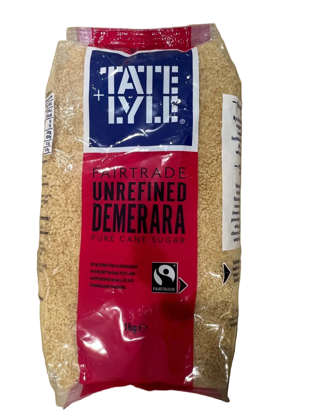 A package of Fairtrade Unrefined Demerrara Pure Cane Sugar, showing the light brown granulated sugar through a clear plastic bag with a red and blue label, placed on a cardboard surface.