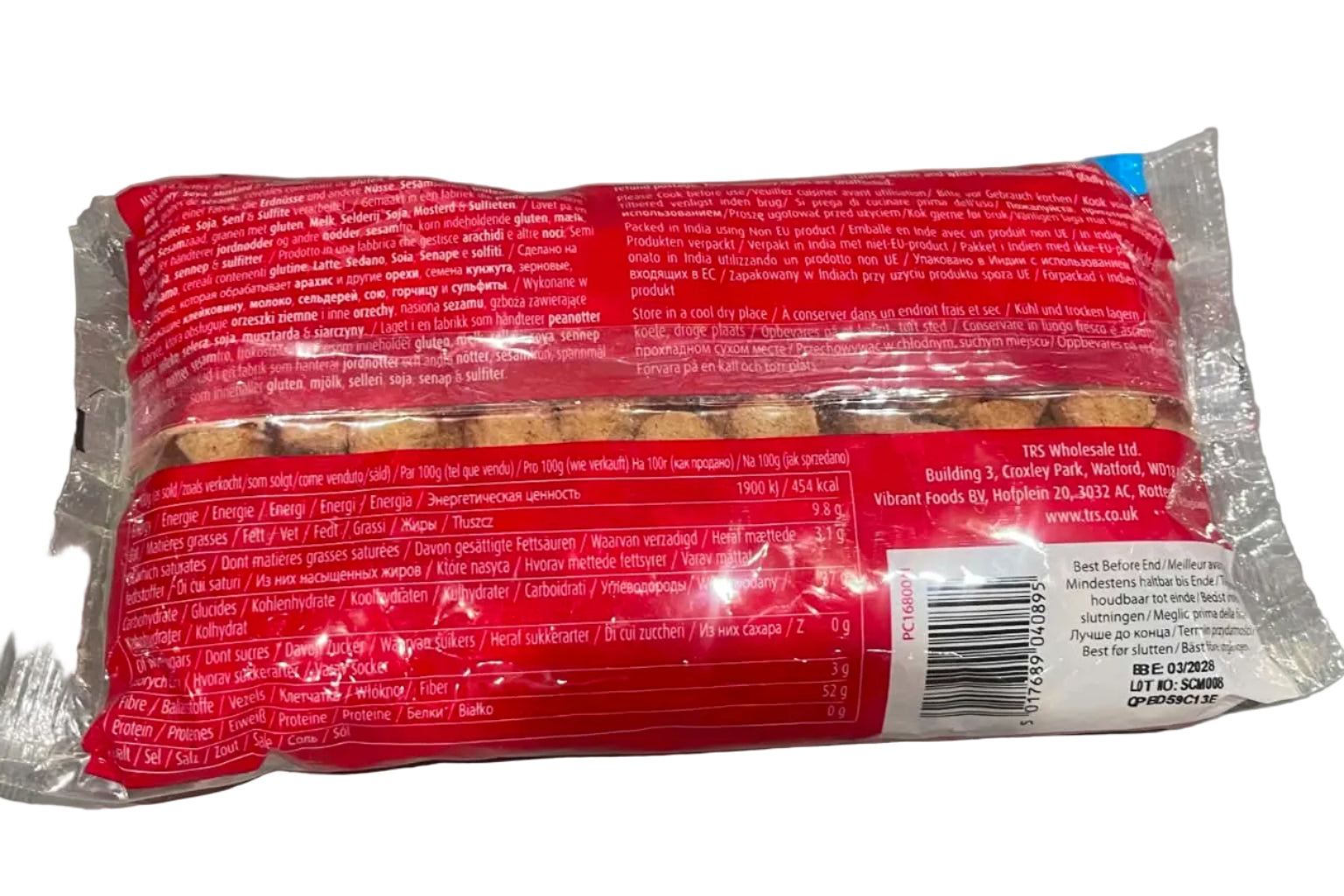 A packaged food product, likely a sausage or meat roll, in clear plastic wrapping with a bright red label and a white barcode sticker, photographed on a gray tabletop.