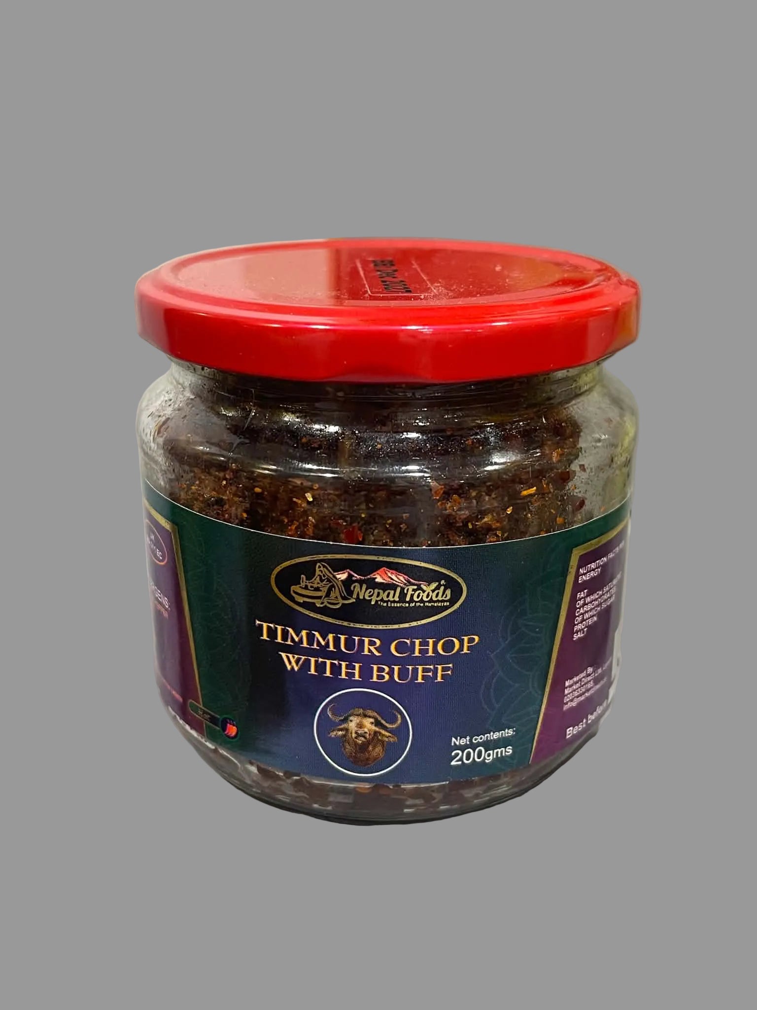 A 200g glass jar of Nagesh Redda Timmur Chop with Buff, featuring a red lid and a dark green label, set on a white surface.
