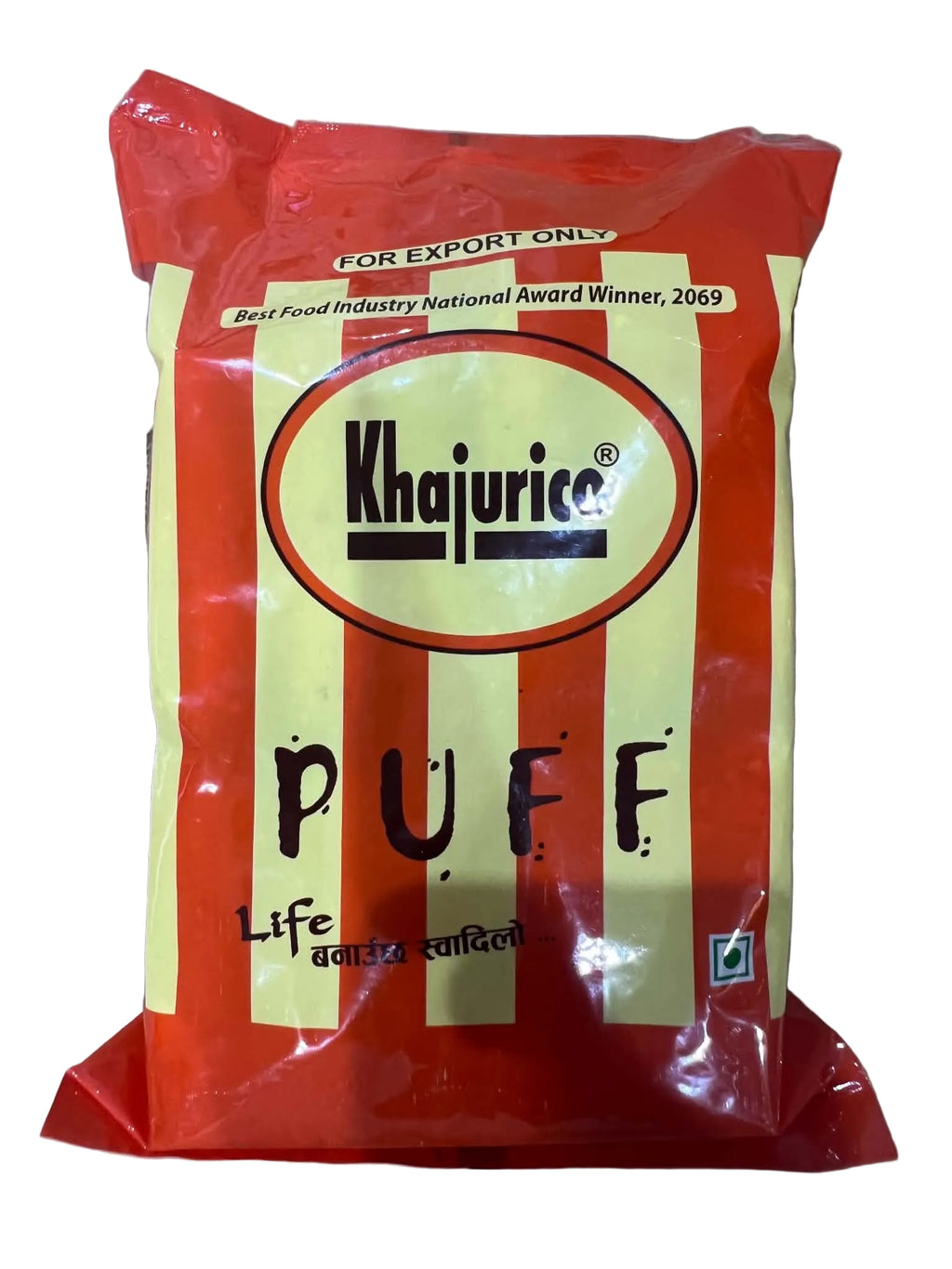 A package of Khejurica Puff Life Added Special, featuring red and pale yellow striped packaging with black text, photographed on a gray cardboard background.