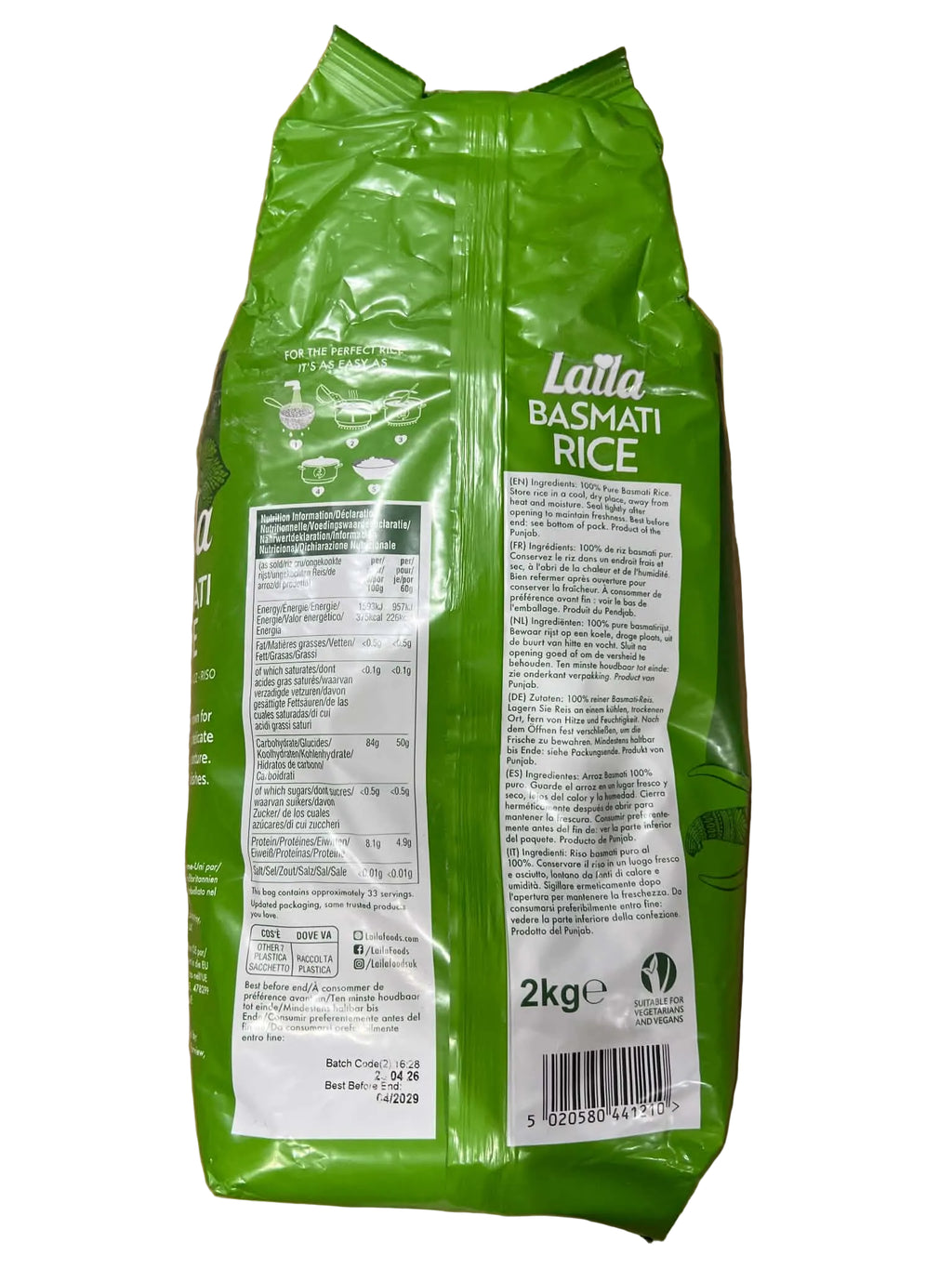 A 2kg bag of Lata Basmati Rice, showing the back of the green packaging with white labels, placed on a brown cardboard surface.