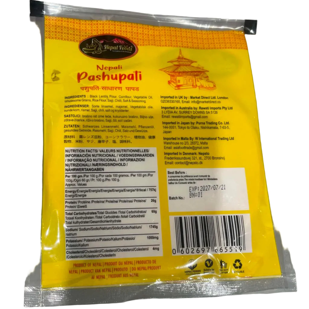 A sealed plastic pouch of Nepal Pashupali protein powder, showing the back label in yellow, white, and orange on a gray surface.