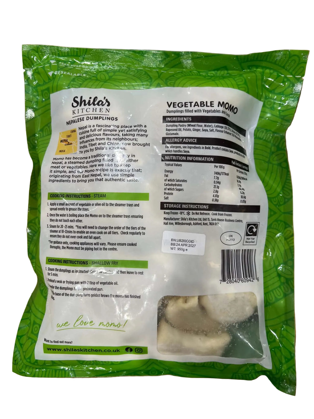 A bag of Shile's Kitchen Vegetable Mono mashed potatoes, showing the back of the packaging with product details, nutrition facts, and a clear window revealing the light beige potato chunks inside, set on a wooden surface.
