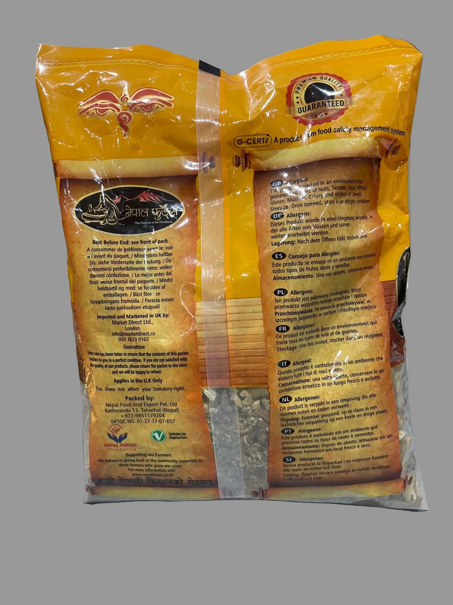 Two orange bags of Darjeeling Darhalli tea leaves, showing the printed product details and instructions on the front and back, set against a neutral gray background.