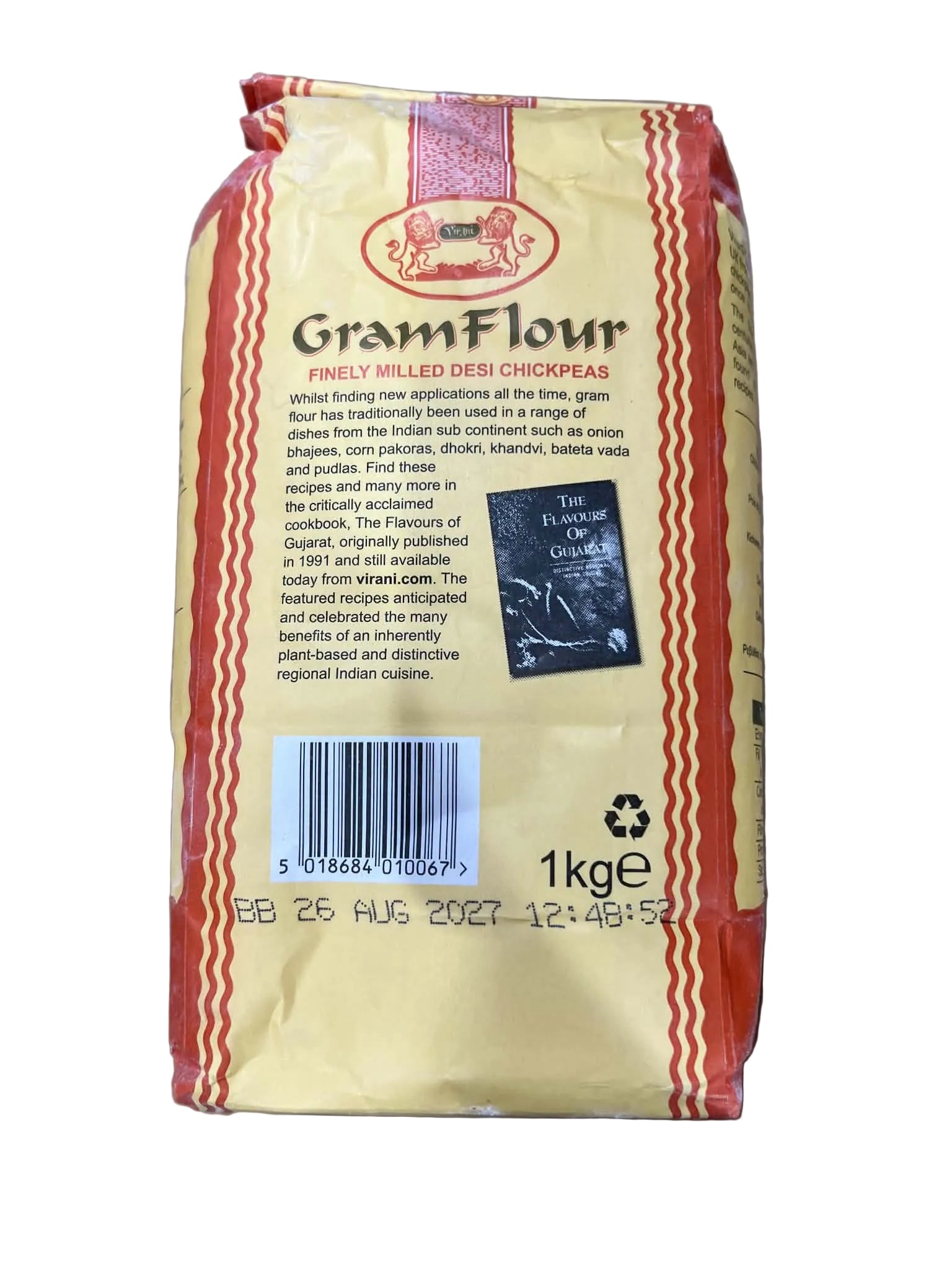 A 1kg bag of Grand Flour Milling Co. Mill-Filled Bread Crumbs, showing the back of the packaging with a barcode, product details, and a black sample crumb photo on a beige background.