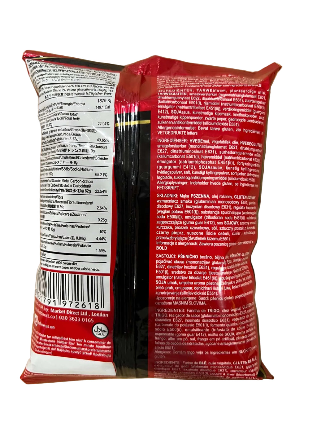 The back of a red and white plastic bag of pasta, showing the nutritional facts panel on the left and extensive ingredient text on the right, photographed on a brown cardboard background.