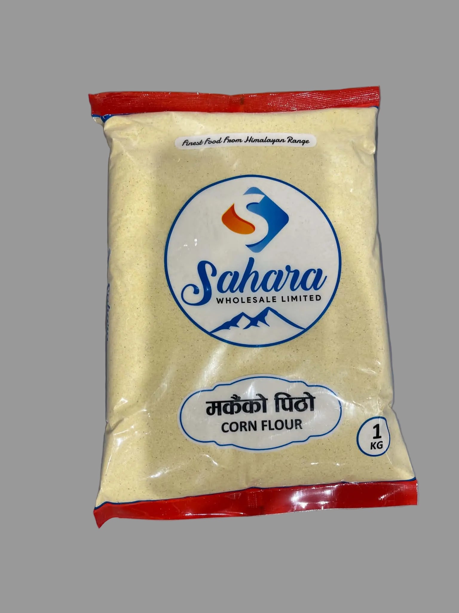 A 1 kg bag of Sahara Wholesale Limited Corn Flour, featuring a light yellow powder inside a clear bag with red top and bottom seals and a blue and white logo on the front.